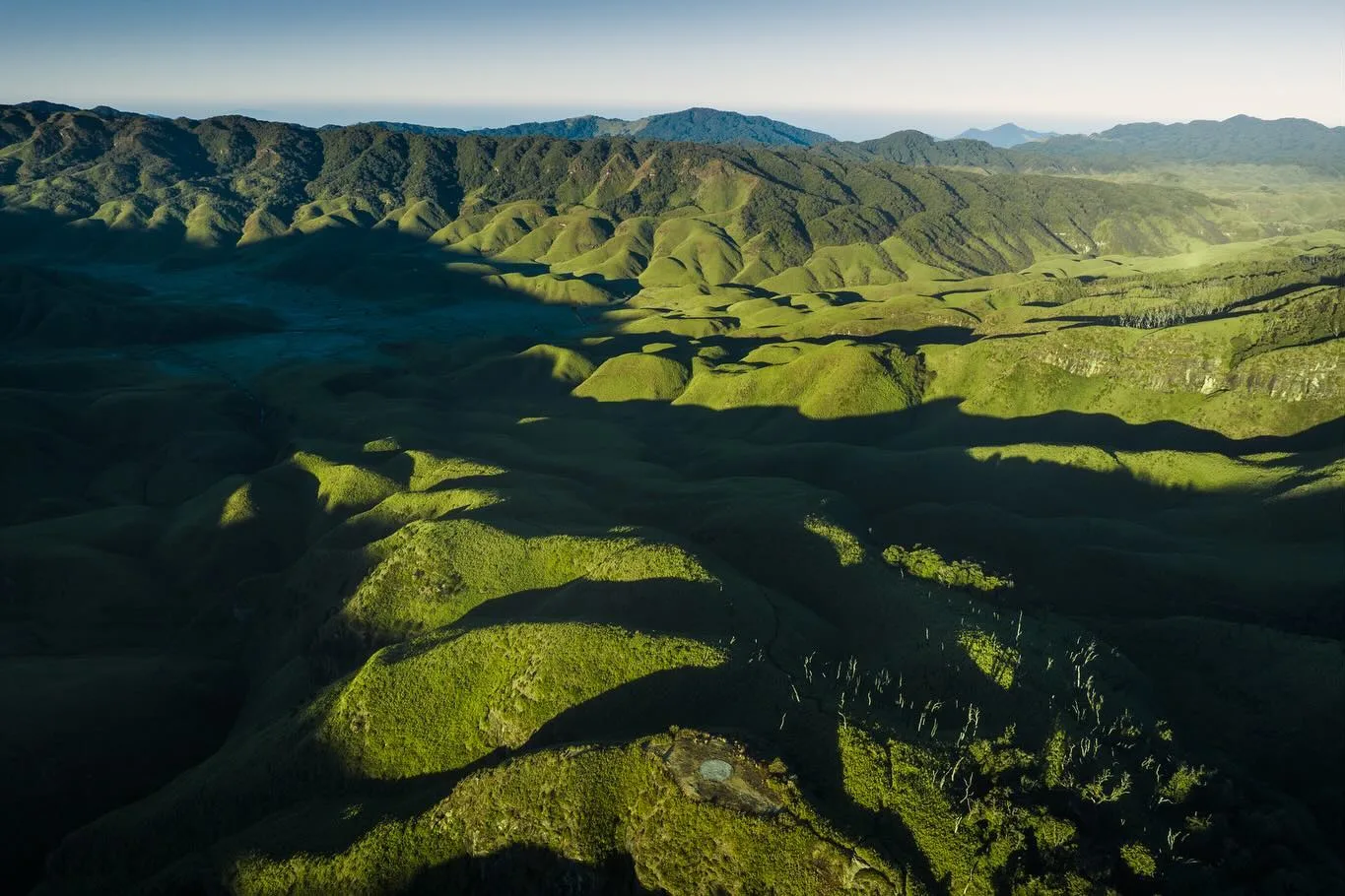 An aerial view of the rolling green hills of Dzukou Valley.